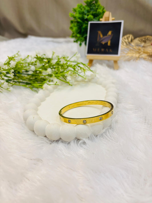 Elegant Stone-Studded Gold Bracelet